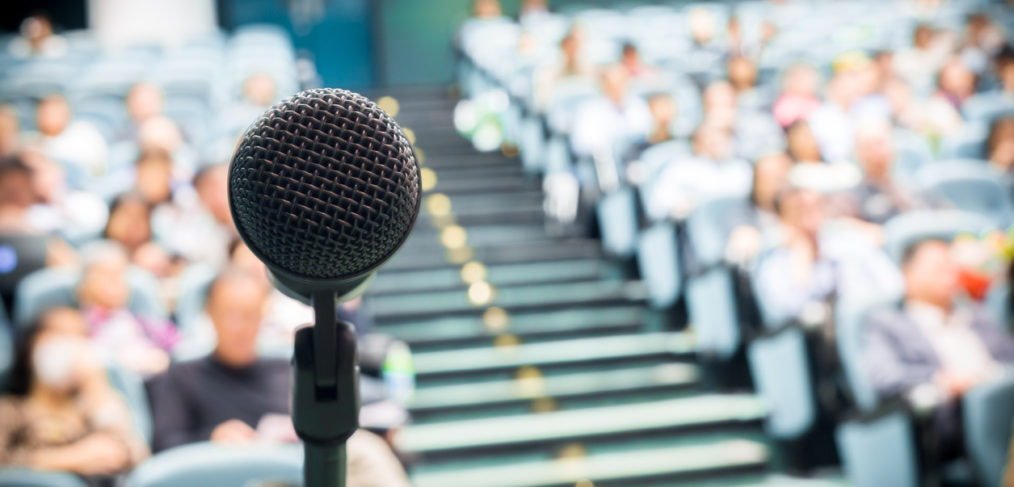 Microphone with crowd presentation photo